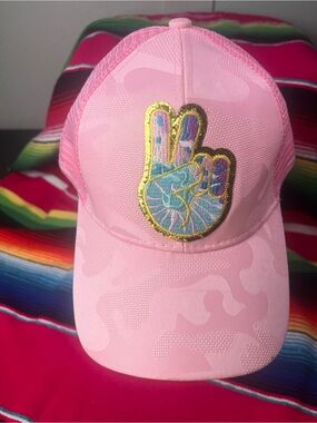 Pink Peace Sign Patch, subtle camo print, Trucker Hat with messy bun back